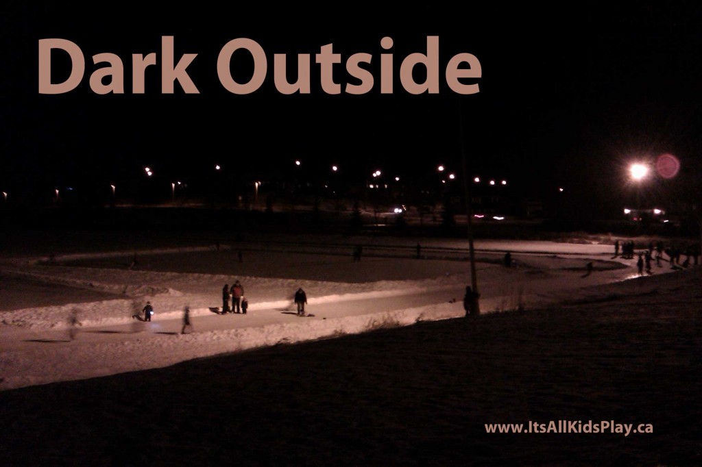 Dark Outside. Picture of children and families playing outside in the dark--night skating.