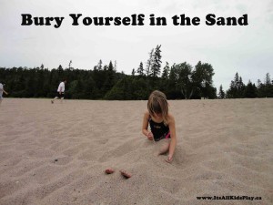 Bury Yourself in the Sand - girl burying her legs in the sand on a beach.