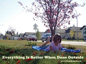 Everything is Better When Done Outside - picture of a girl reading a book under a tree.